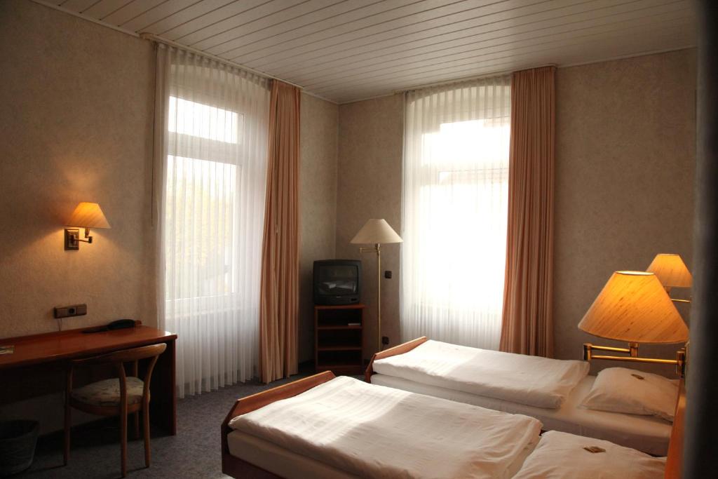 Postel nebo postele na pokoji v ubytování Ackfeld Hotel-Restaurant