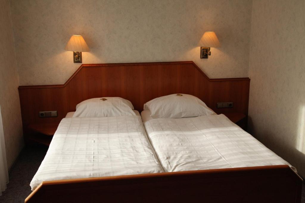 Postel nebo postele na pokoji v ubytování Ackfeld Hotel-Restaurant