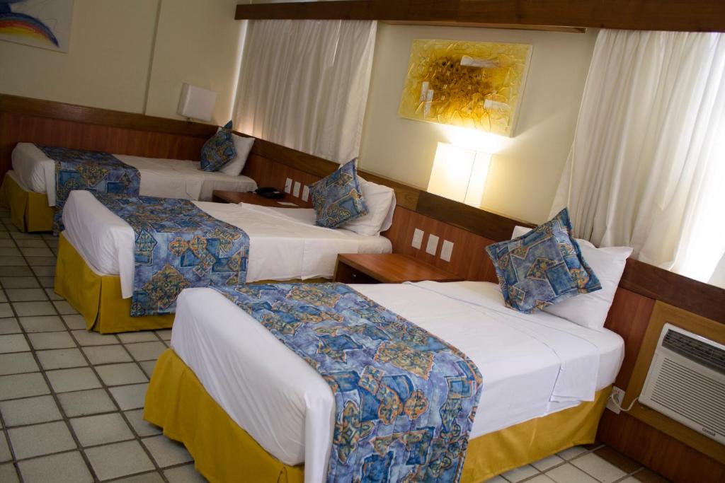 Cama ou camas em um quarto em Hotel Dan Inn Mar Piedade - Grande Recife By Nacional Inn