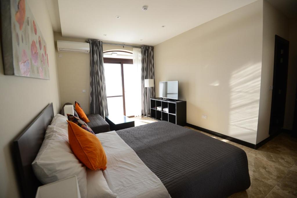 Postel nebo postele na pokoji v ubytování Il-Bukkett B&B