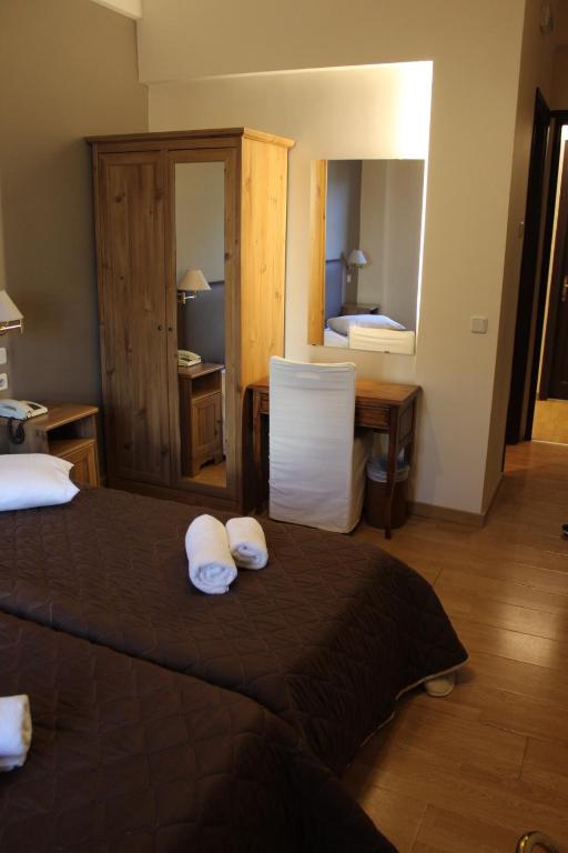 Postel nebo postele na pokoji v ubytování Alkistis Hotel