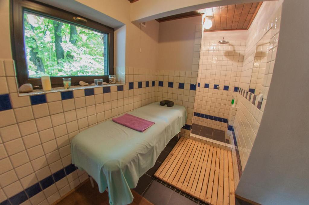 Postel nebo postele na pokoji v ubytování Hotel Vyhlídka
