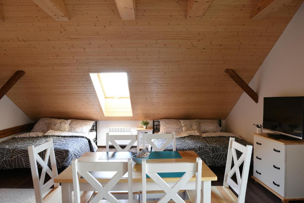 Postel nebo postele na pokoji v ubytování Apartmány Vízmberk