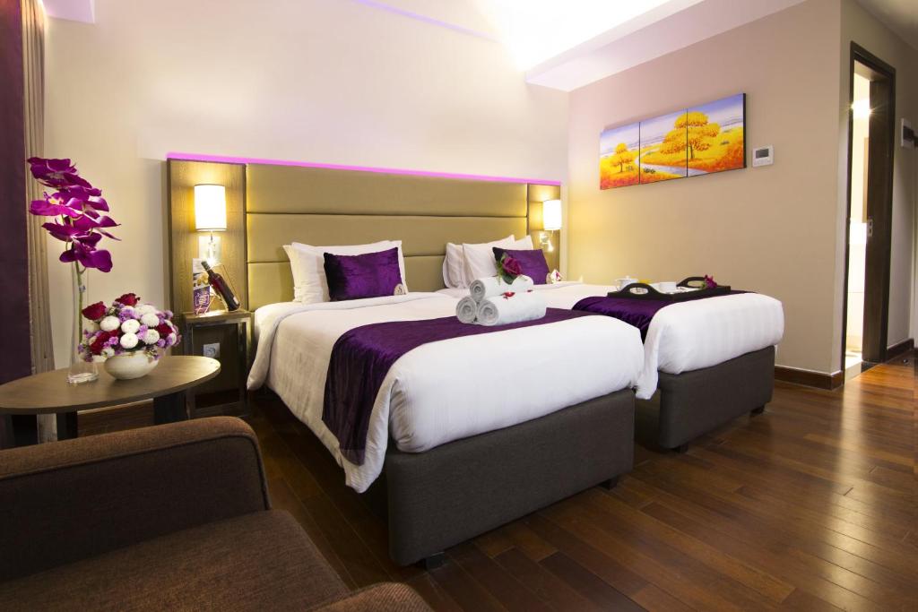 Postel nebo postele na pokoji v ubytování Satoria Hotel Yogyakarta - CHSE Certified
