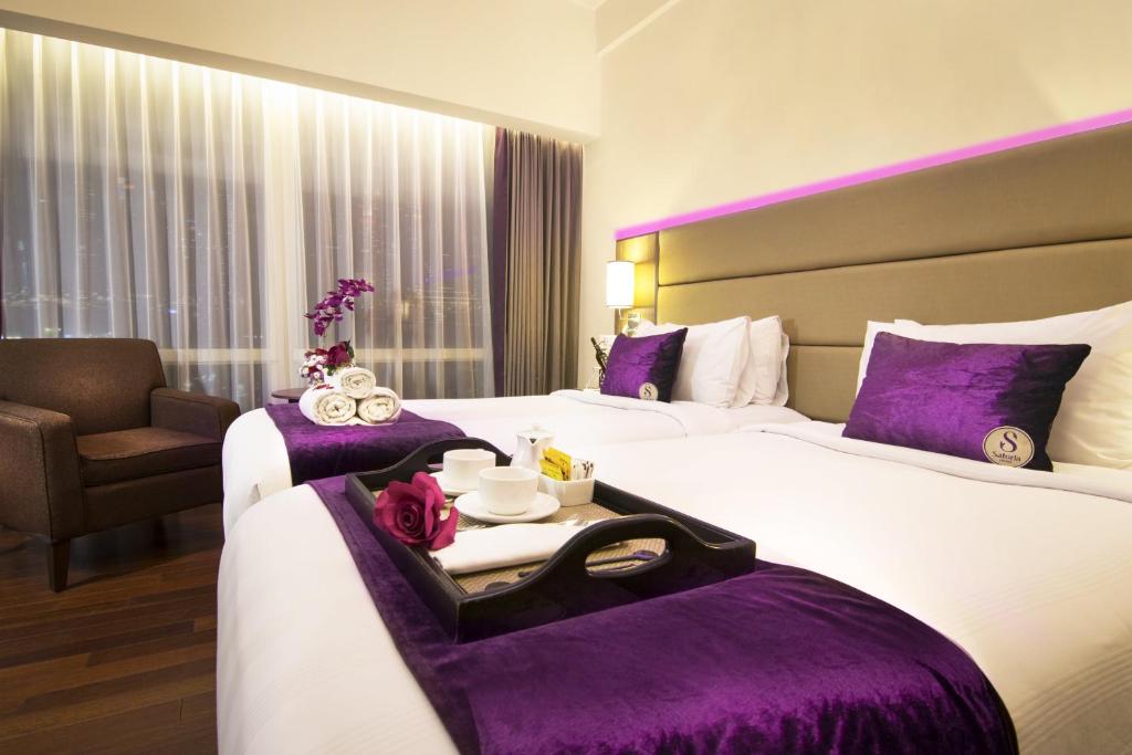 Postel nebo postele na pokoji v ubytování Satoria Hotel Yogyakarta - CHSE Certified