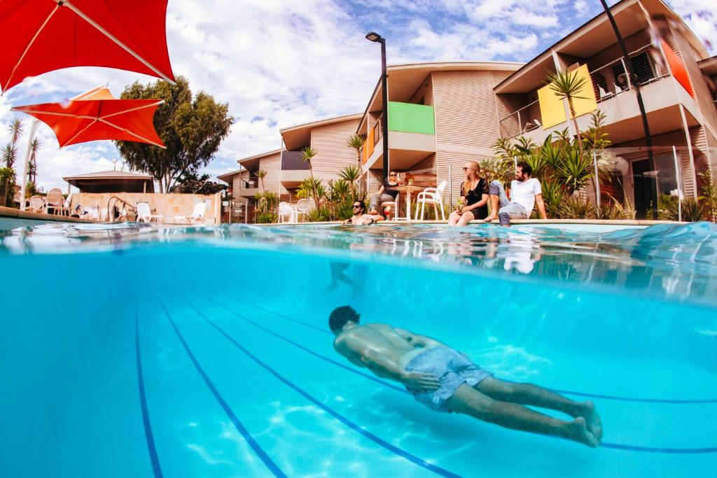 a swimming pool with a person in it at Onslow Beach Resort in Onslow