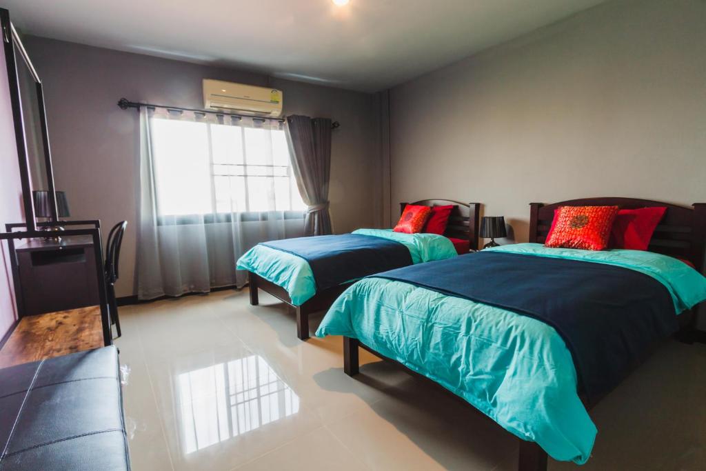 Giường trong phòng chung tại Chez Pom