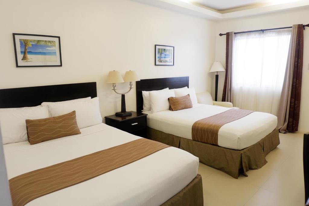 Postel nebo postele na pokoji v ubytování Chateau De Boracay