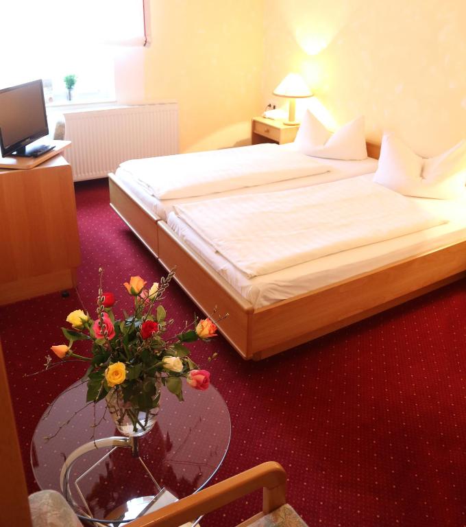 Voodi või voodid majutusasutuse Landhotel & Reiterhof Schumann toas