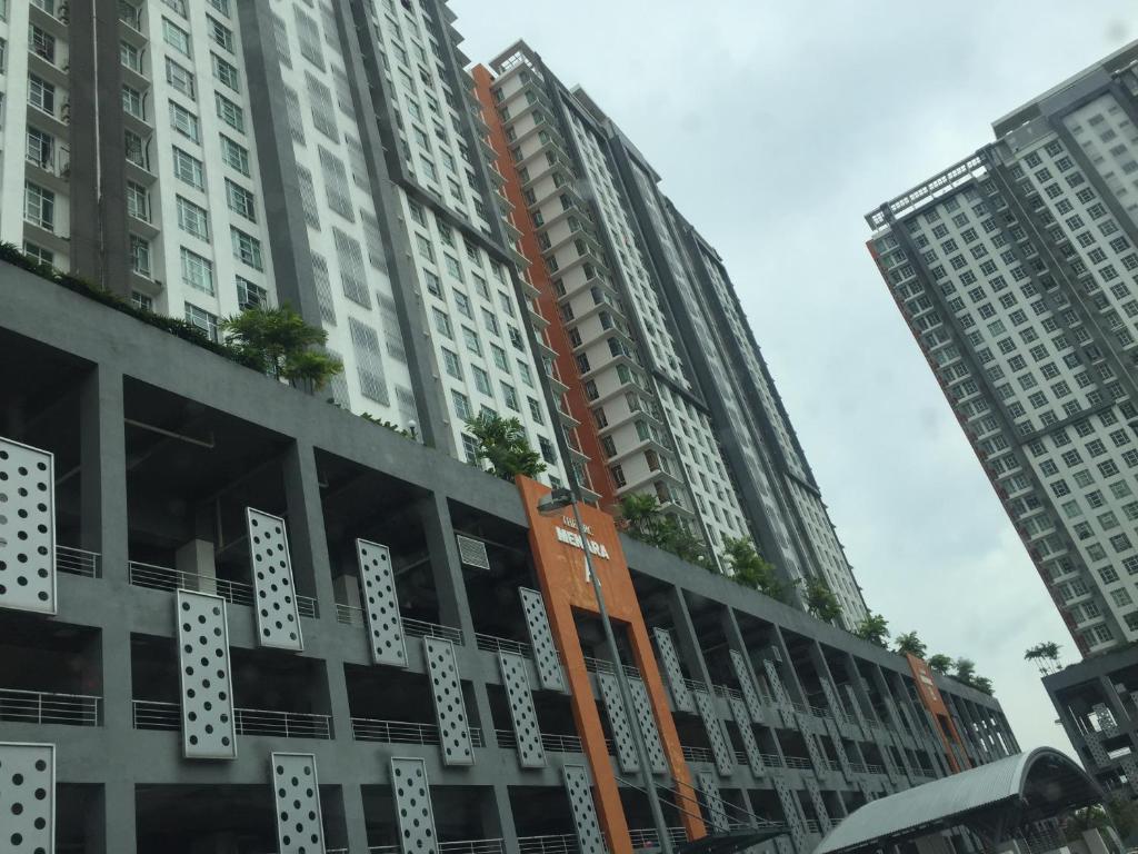 a group of tall buildings in a city at Hayat Homestay @ The Arc, Cyberjaya in Cyberjaya
