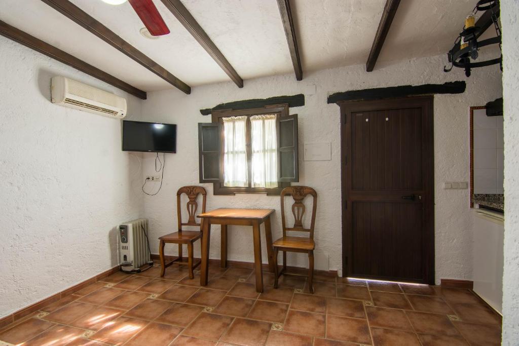 TV a/nebo společenská místnost v ubytování Hotel Rural El Cortijo