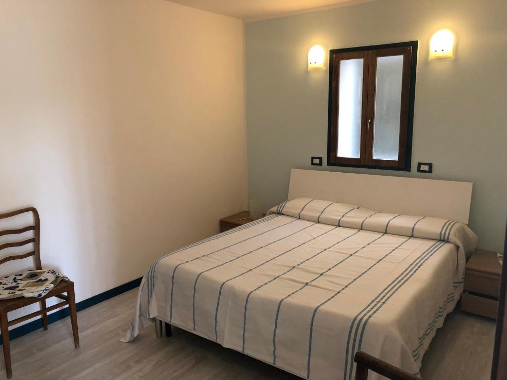 Postel nebo postele na pokoji v ubytování Albergo La Perla