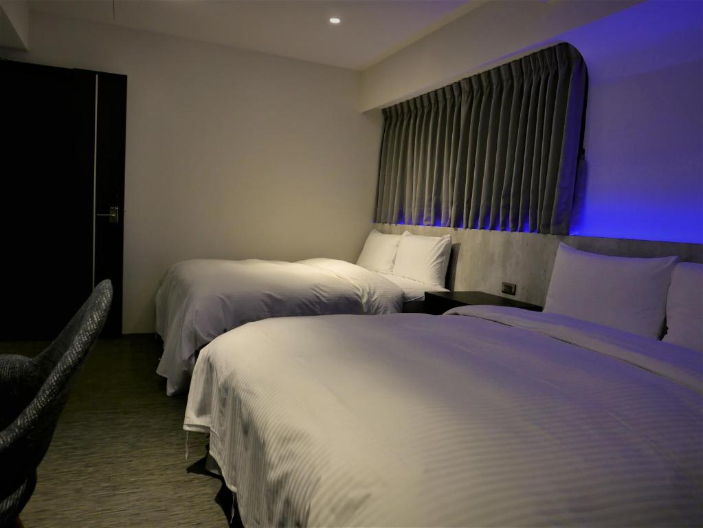 泊居旅店二館 Oursinn Hotel 2にあるベッド