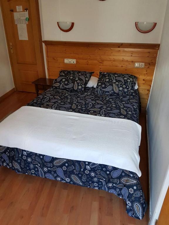 Postel nebo postele na pokoji v ubytování Hotel Merino