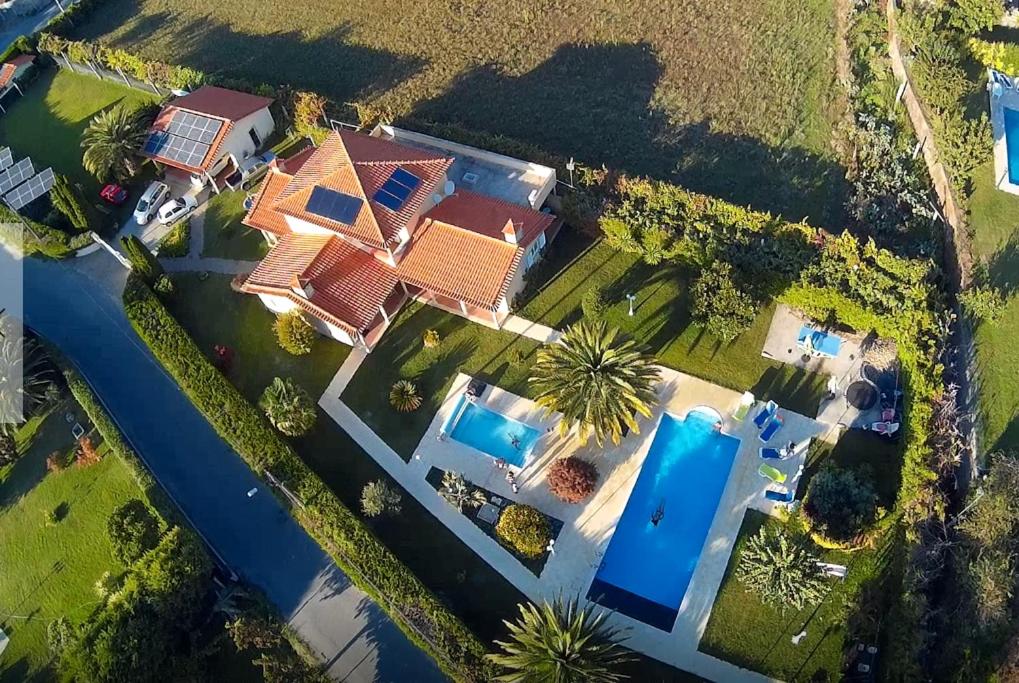 an overhead view of a house with a swimming pool at Arouca Passadiços Alojamento in Arouca