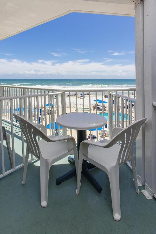 Hotel Sea Club IV Resort, a table and chairs on a balcony with the beach at Sea Club IV Resort in Daytona Beach Shores