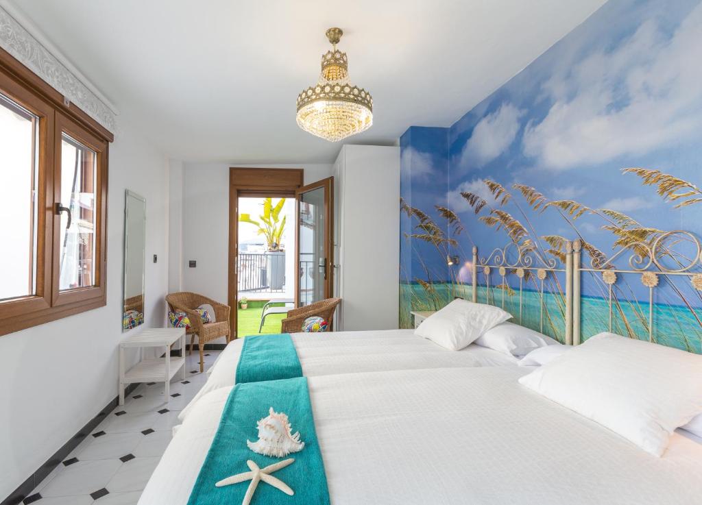 Cama o camas de una habitación en Salamandra Plaza