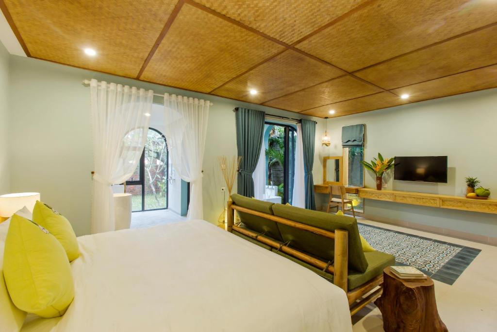Giường trong phòng chung tại Villa De Campagne Hoi An
