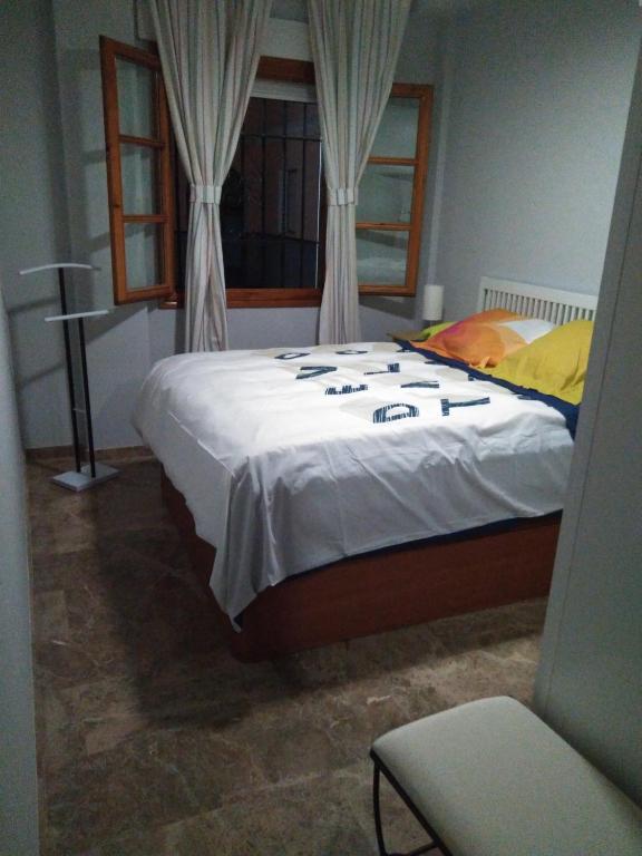 A bed or beds in a room at casa de los patios amurallados