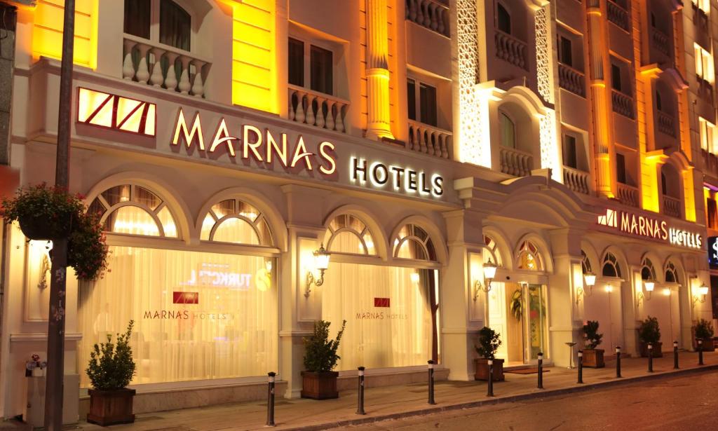 a store front of a mangas hotel at night at Marnas Hotels in Istanbul