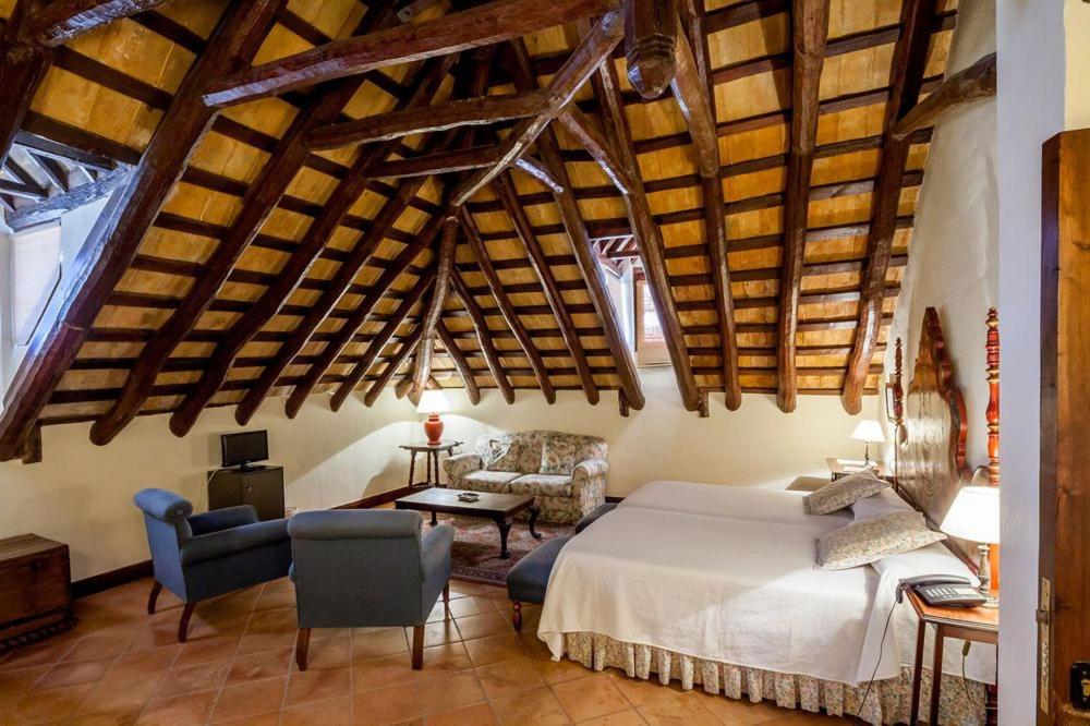 Postel nebo postele na pokoji v ubytování Palacio Marques de la Gomera