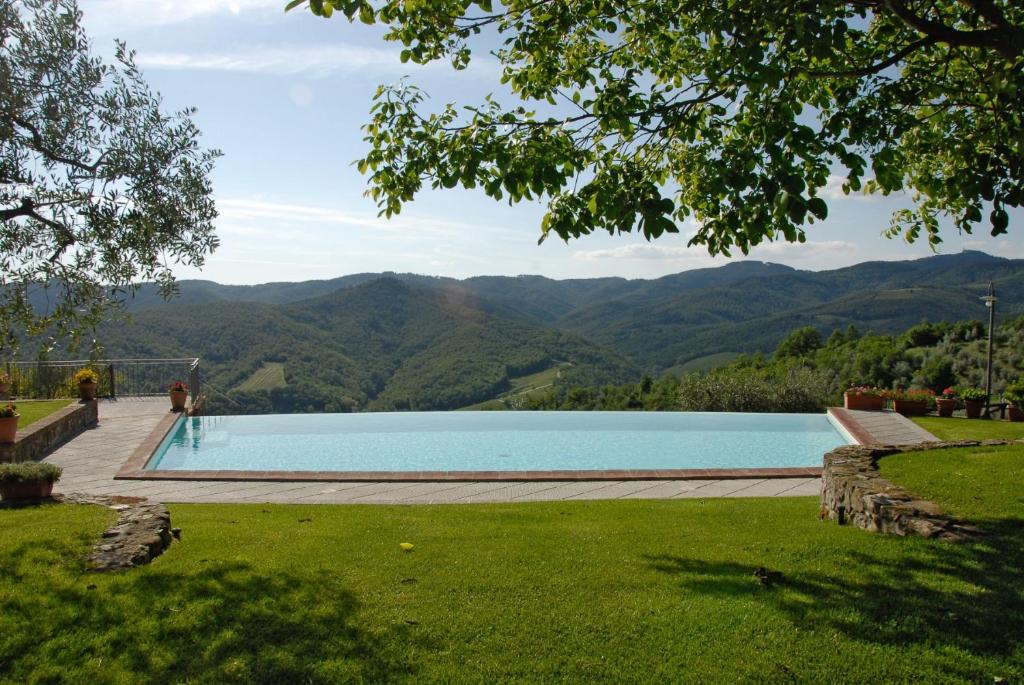 a swimming pool with a view of mountains at Special and Nice close to the Chianti in Bucine
