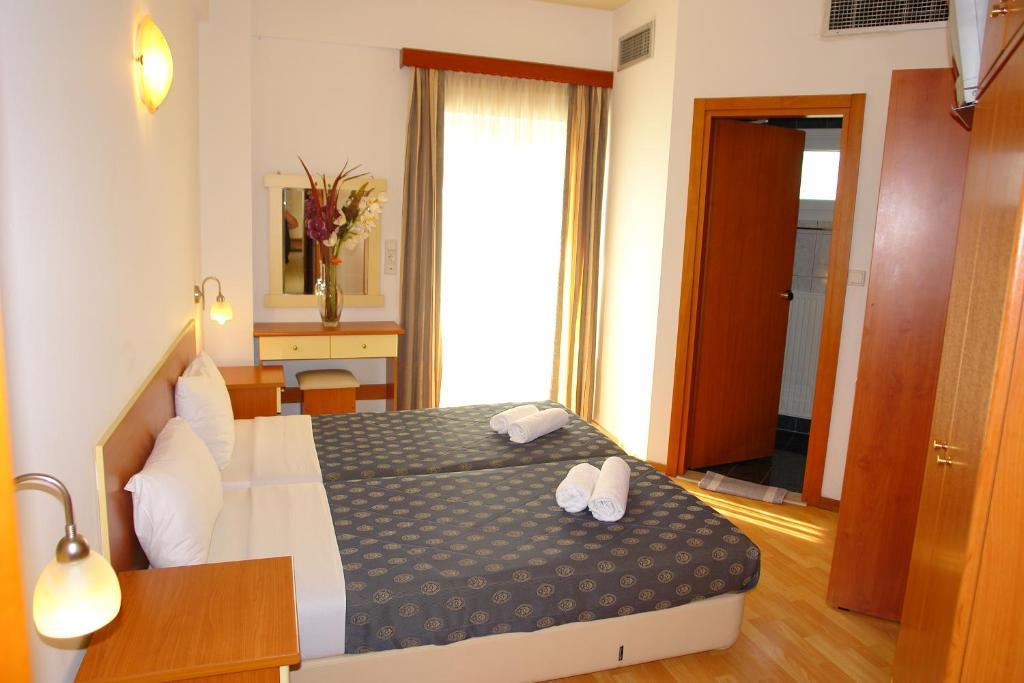Postel nebo postele na pokoji v ubytování Hotel Filoxenia Beach