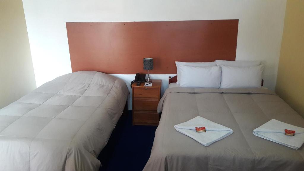 Postel nebo postele na pokoji v ubytování Kurumi Hostel