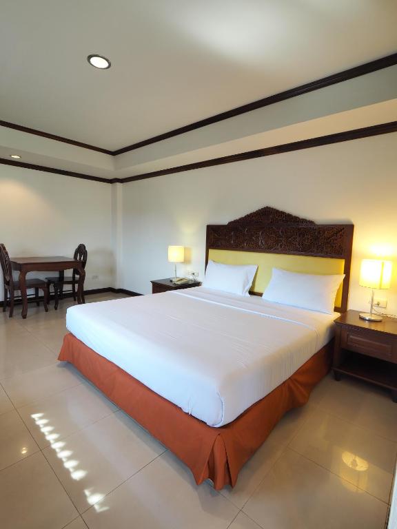 Postel nebo postele na pokoji v ubytování Golden Villa Pattaya