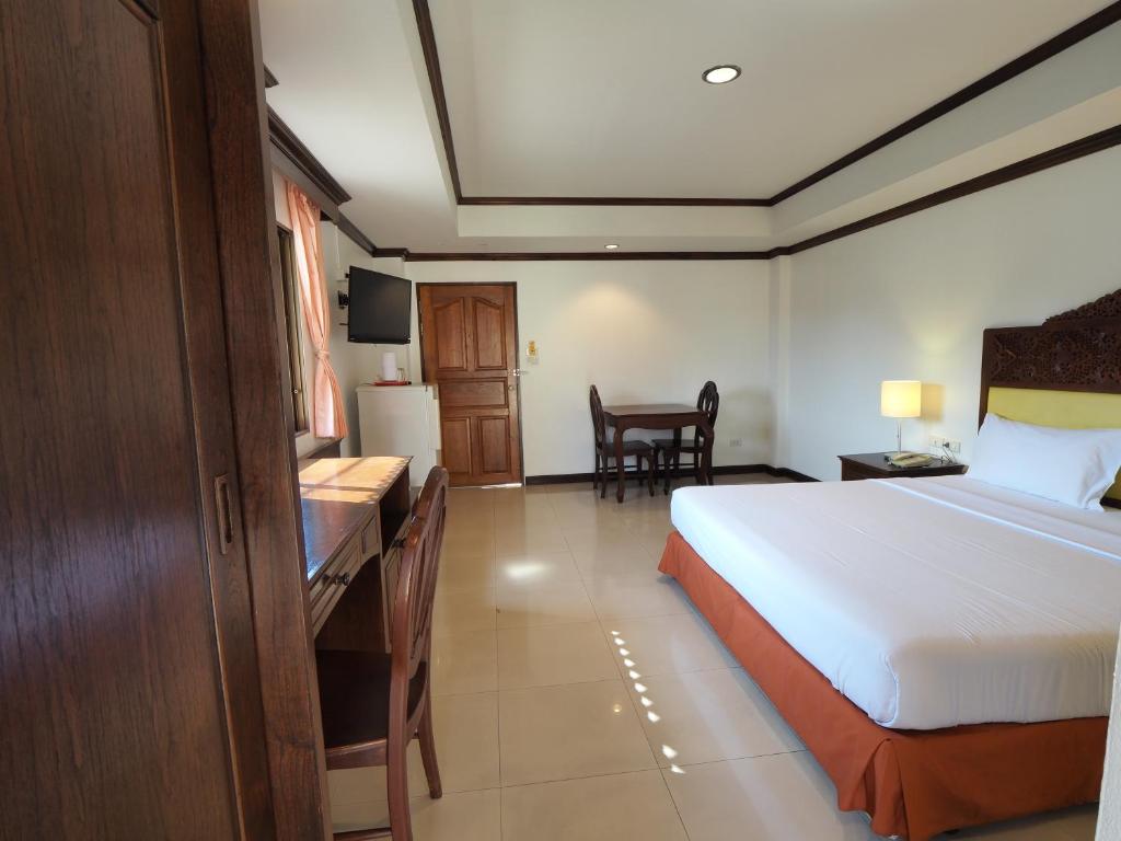 Postel nebo postele na pokoji v ubytování Golden Villa Pattaya