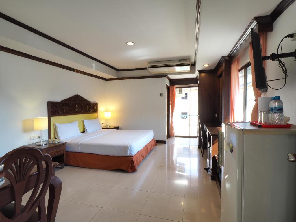 Postel nebo postele na pokoji v ubytování Golden Villa Pattaya