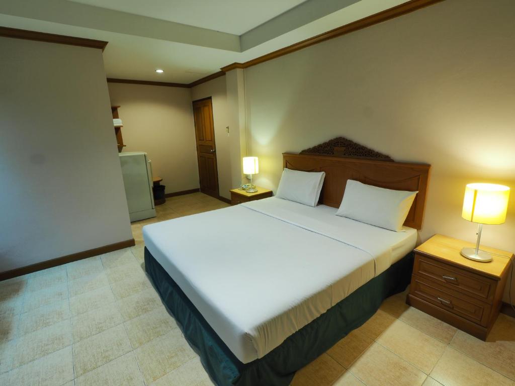 Postel nebo postele na pokoji v ubytování Golden Villa Pattaya