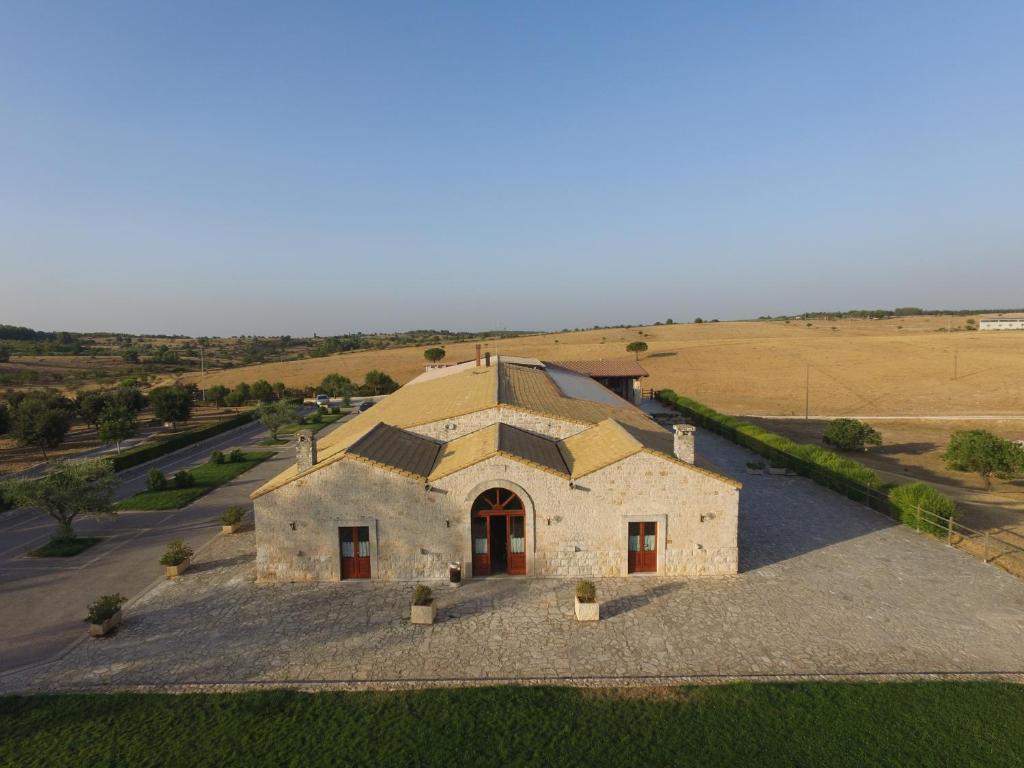 an aerial view of a large stone building in a field at Masseria Chinunno in Altamura