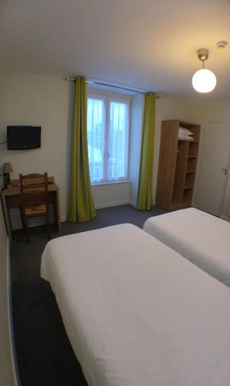 Postel nebo postele na pokoji v ubytování Hôtel Le Verger