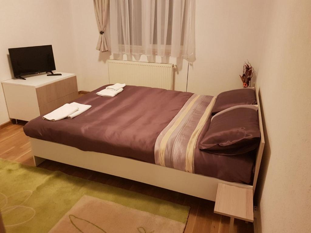 Postel nebo postele na pokoji v ubytování BigCitty Rooms