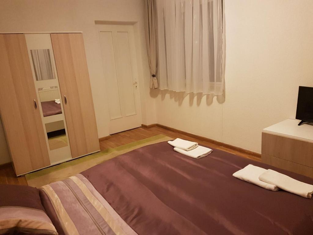 Postel nebo postele na pokoji v ubytování BigCitty Rooms