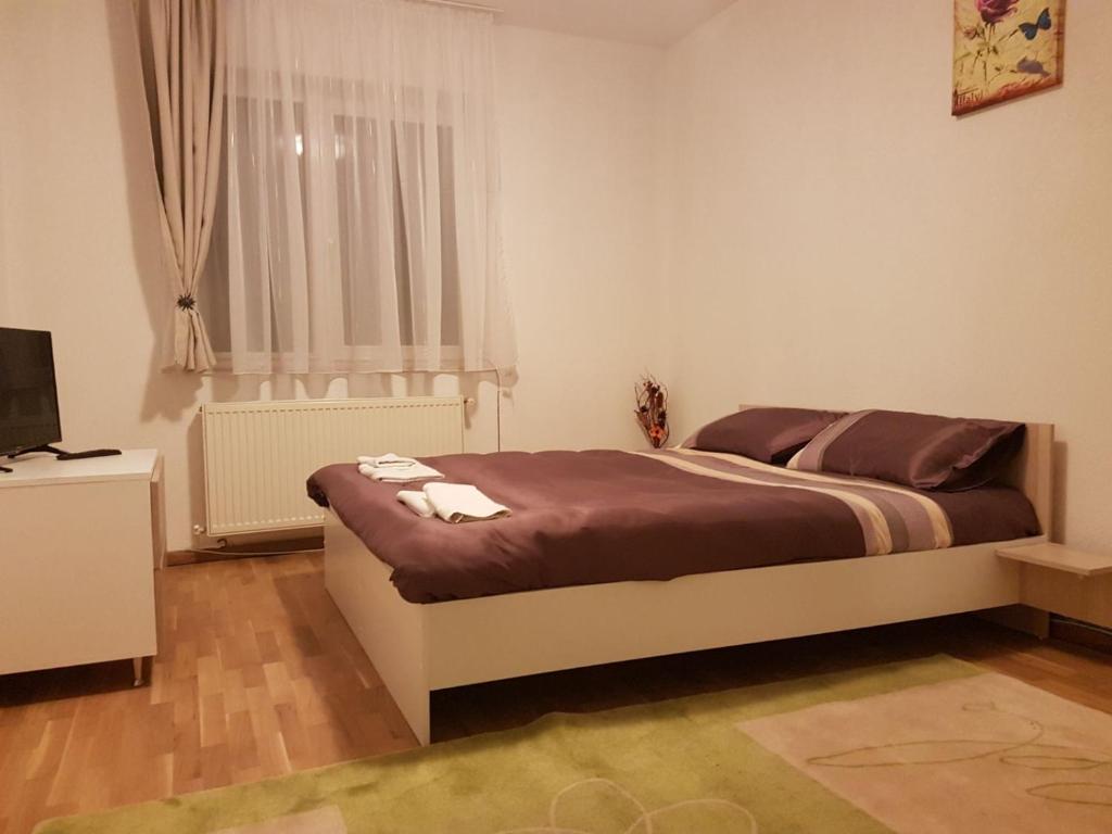 Postel nebo postele na pokoji v ubytování BigCitty Rooms