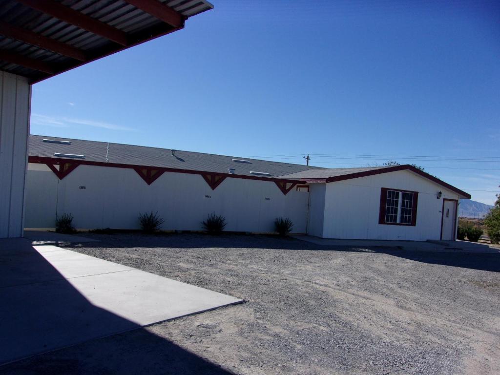 a large white building with a roof at Casita in Pahrump