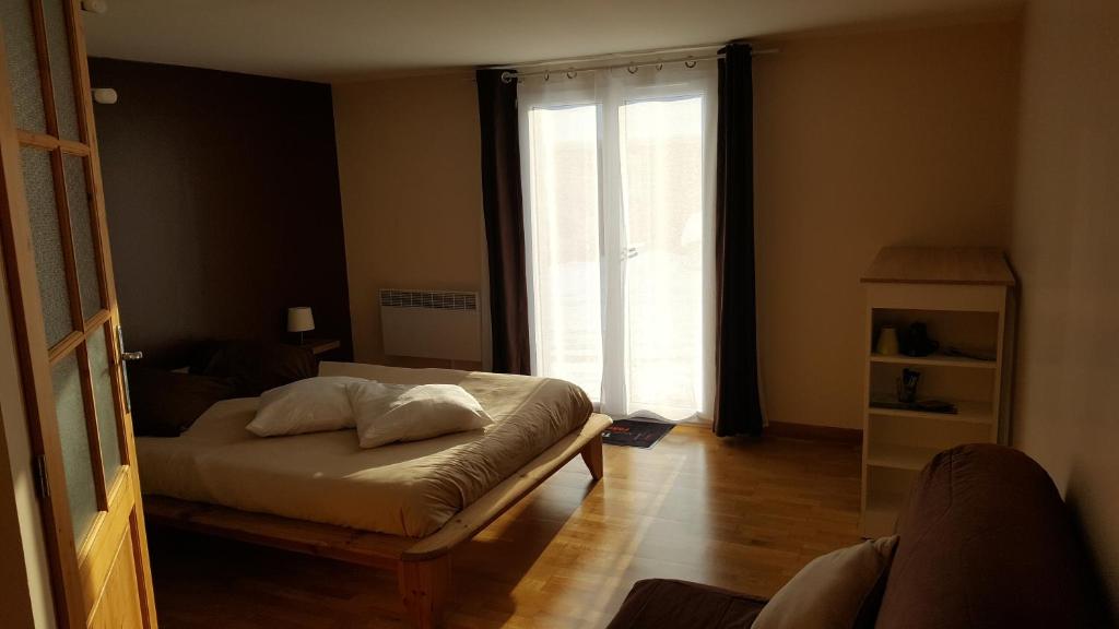 מיטה או מיטות בחדר ב-Chambre d hôtes du lac