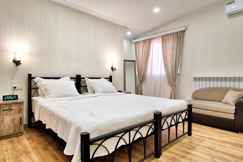 Postel nebo postele na pokoji v ubytování Q&B House