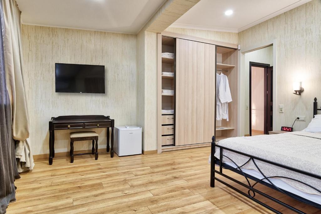 Postel nebo postele na pokoji v ubytování Q&B House