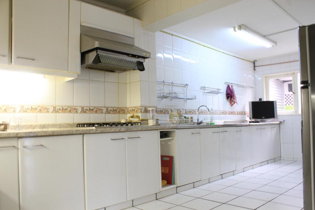 Kuchyň nebo kuchyňský kout v ubytování Kapai Hostel
