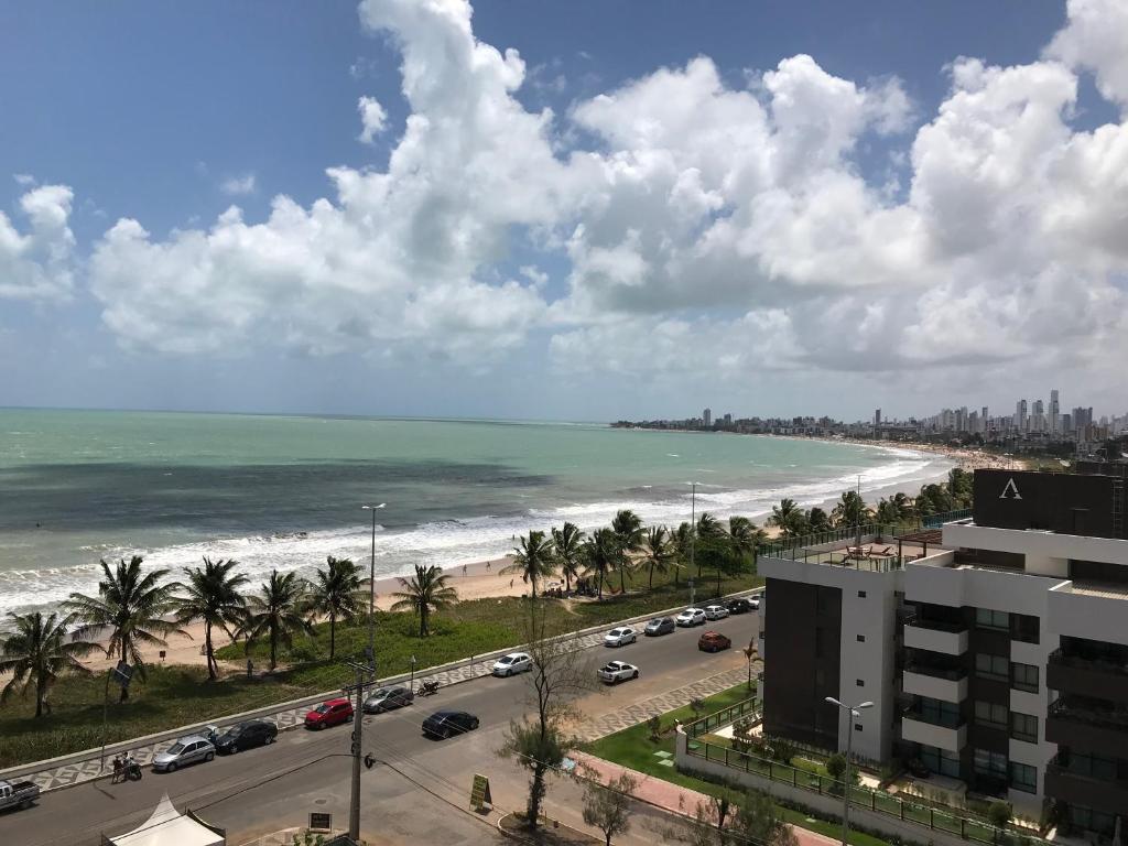 a view of the beach from a building at Flat Mar Belo Intermares in Cabedelo
