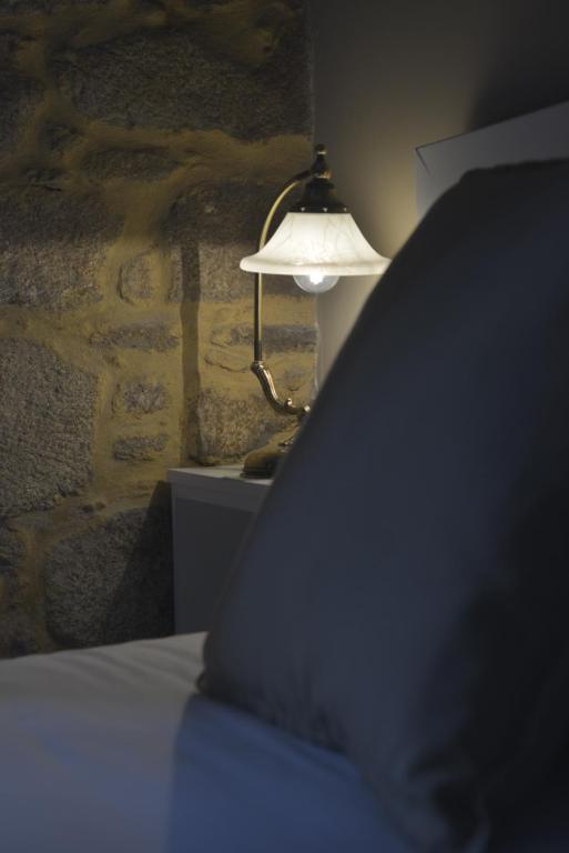 Postel nebo postele na pokoji v ubytování Hotel Gastronómico Casa Rosalia