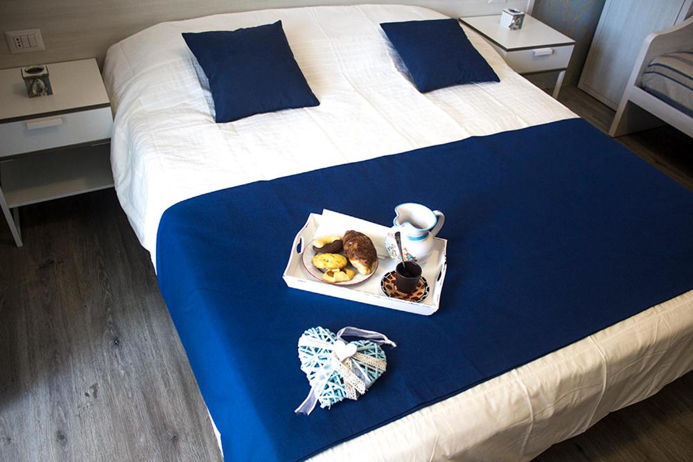 Łóżko lub łóżka w pokoju w obiekcie B&B Villa Montreux
