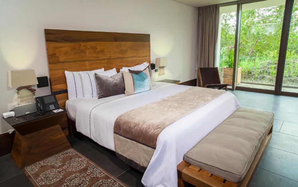 Postel nebo postele na pokoji v ubytování NIZUC Resort & Spa