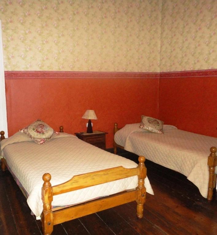 Postel nebo postele na pokoji v ubytování Hotel Garden