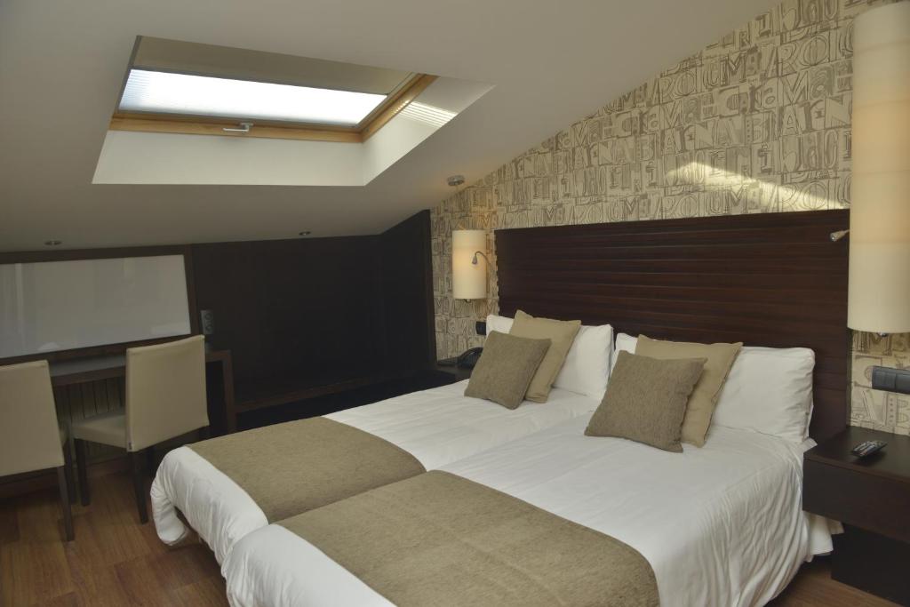 Postel nebo postele na pokoji v ubytování Hotel Gastronómico Casa Rosalia
