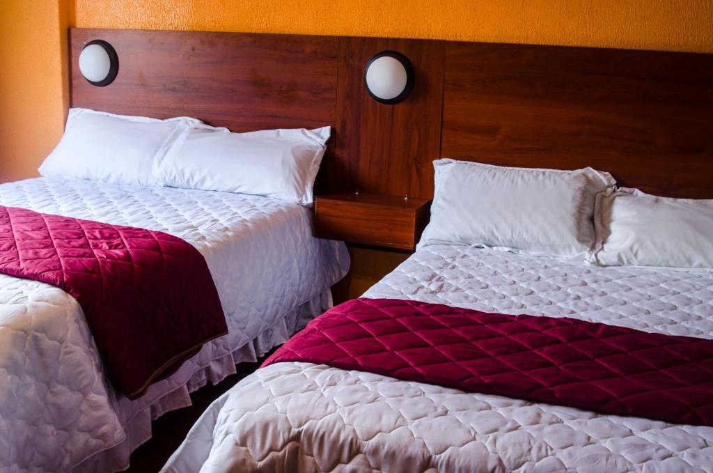 Postel nebo postele na pokoji v ubytování La Estación Hostal