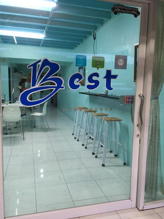a restaurant with a cel test sign on the wall at Best Rent a Room in Nai Yang Beach
